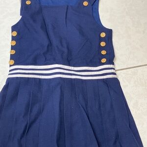 Beautiful, navy blue jumper with white accents and gold buttons.